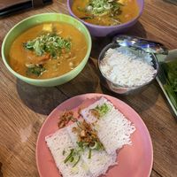 purple bowl- vegan duck in curry coconut, green bowl- vegan meat in curry coconut, additional steamed rice and rice noodles because “wok” dishes don’t contain carbs   at Anan Saigon Streetfood in Utrecht