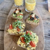 First round high tea: parsnip/sweet potato soup and sandwiches with chicken curry salad and pea pesto salad  at Black & White Kafe in Breda