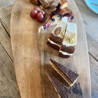 Third round high tea: banana bread, berry cheesecake, carrot cake and a chocolate date pie  at Black & White Kafe in Breda