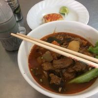 Spicy soup, soy bean milk, and a taro cake  at Ahaa Boer Vegetarian Food in Battambang