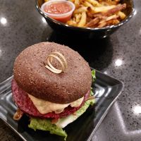 The Delux Burger with fries at Copper Branch in Edmonton