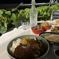 Vegan katsu curry, side beans, side pasta, risotto balls and spring rolls  at Darwin Trailer Boat Club in Fannie Bay