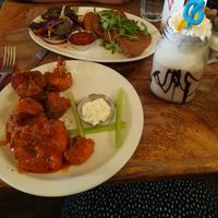 Cauliflower buffalo wings, seitan escalopes and chocolate and orange milkshake  at Brooklyn Cafe in Glasgow