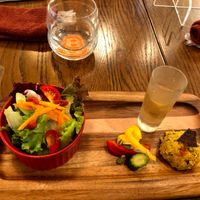 appetizer salad with pickled veggies, some paste and a shot of sweet juice to balance the sour salad dressing. very good! at Premarché Alternative Diner in Kyoto