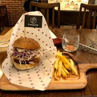 tempeh burger with banana chips and fries on the side at Premarché Alternative Diner in Kyoto