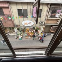 View of market across the street  at Premarché Alternative Diner in Kyoto