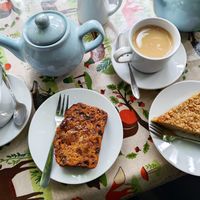 Tea loaf, ginger flapjack and tea with oat milk at Scarthin Books Cafe in Cromford