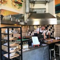 Inside/Open kitchen at Happy Rooster in Stockholm