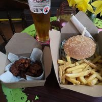 Dirty burger and fries with spicy cauliflower wings. at Le Pub in Newport