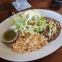Two tacquitos. (They're in there under the veggies) at Cocina Michoacana in Oakdale