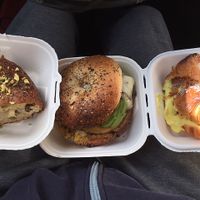 my order: croissant w lemon crema; a pistachio maple torta; everything bagel w just egg, violife mozz, avocaodo, and more at Fermento in Long Beach