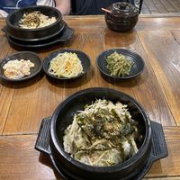 An order of two mushroom & tofu bibimbap with side dishes.  at Dubuga Tofu Go - Bibimbap Restaurant - 두 부가 in Busan