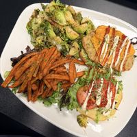 Fish sandwich with Brussels and sweet potato fries   at The Reizod Vegan Experience in Columbia