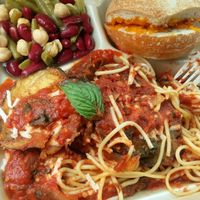 Eggplant park, 3 bean salad and cheesy bread. at The Reizod Vegan Experience in Columbia