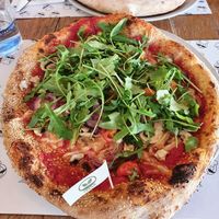 Sesame dough, Vegan mozzarella,  mushroom, onion , pomodori,  rucola at Mister Pizza - Duomo in Florence
