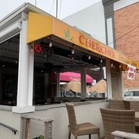 Outdoor seating in the open and under the overhang at CherCher Ethiopian Cuisine in Bethesda