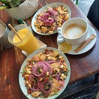bowls venere with extra vegan chicken, mango smoothie and coffee with oat milk at Kino in Barcelona