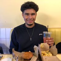 Me posing with food   at Rudy's Dirty Vegan Diner in North West London