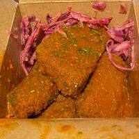 Seitan Buffalo wings in hot sauce and coleslaw at Rudy's Dirty Vegan Diner in North West London