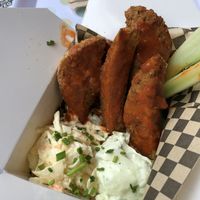 Buffalo chicken wings with slaw and blue cheese sauce at Rudy's Dirty Vegan Diner in North West London