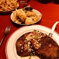 Fries, buffalo “wings” and eggplant parma  at The Imperial Erskineville Main Bar in Erskineville