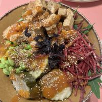 Miso glazed tofu bowl: green mix, black rice, edamame, miso glazed tofu, raw beetroot, Asian-style marinated cucumbers, sesame seeds, spicy miso and vinegar dressing, nori flakes  at Shake Cafe - Camillo Cavour in Florence