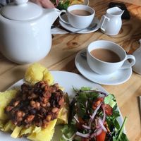 Baked potato with beans / cheeze + tea with soy milk at Darnley Coffee House in Stirling