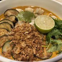Malacca Laksa - Laksa curry, rice noodle, tofu, zucchini, eggplant, crispy shallot, lime  at Jumon in Belfast