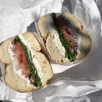 Onion bagel, garlic and herb spread, lettuce tomato and red onion. Best combo   at Tompkins Square Bagels in New York City