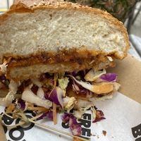 Delicious schnitzel but oversized bun at MooFree Burgers - Food Truck in Morningside