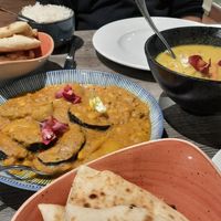 Vegan korma, a super tasty baked aubergine and lentil curry, garlic naan, peshwari naan, basmati rice at Indi-Yang in Torquay