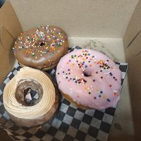 Pictured bottom, clockwise: apple cider cake,  chocolate dip, homer at Daddy O Doughnuts in Mississauga