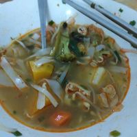 Half decimated yummy vegan pho chocked full of veggies and tofu at Vietnamese Coffee & Noodle Soup in Siem Reap