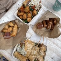 Prawn rolls, bean curd rolls, satay chicken skewers and pad see ew.  at Plant Based Eatery - Food Stand in Wollongong