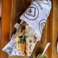 Wrap with palm heart, grilled veggies, tomatoes, and vegan pesto   at Manuê in Paraty