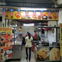 Tables in front of the restaurant in the food court at Raja Punjabi - Food Stall in Kuala Lumpur