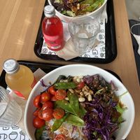 BeVegan salads (they were out of cilantro so we got cherry tomatoes instead) plus kombucha with carrot & turmeric and red berries.  at beGreen in Valencia