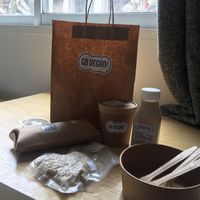 Tempeh burrito with guacamole, green curry with brown rice & almond milk.  at Go Vegan! Grab N Go in Guangzhou