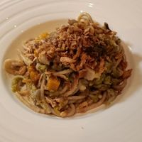 Bigoli integrali con ragù di verdure invernali, cipolla fritta, pesto di prezzemolo e anacardi at Osteria Caffe Monte Baldo in Verona