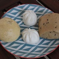 Pau : left to right : with sweet peanuts, with black sesame sweet paste, plain with brown sugar and sesame seeds. at Tze Ern Vege Restaurant 慈恩素食 in Kuala Lumpur