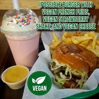 This yummy meal is an impossible burger & French fries. I also had a strawberry shake & I bought a little cup of melted cheese so I can dip my fries in it. Instagram Worthy meal  at Ken's Diner in Skokie