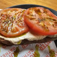 Sourdough with ricotta, huge tomatoes and basil oil at Hunter Gatherer in Portsmouth
