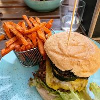 "Der Italiener" ("The Italian") burger with grilled veggies and vegan cheese, comes with sweet potatoe fries and ketchup/vegan mayo. at Vrohstoff in Wurzburg