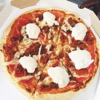 Vegan "vebab" pizza with vegan cheese, seitan, vegan mayo and vegan sour cream. at Bullizza in Ljubljana