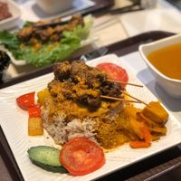 The. Fried. Egg. On. This nasi goreng type dish.  (Under the skewers)  at Loving Hut - Amoy Plaza in Kowloon