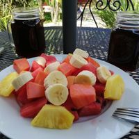 Large fruit plate and iced coffee at Casa de Cafe B&B in Copan Ruinas