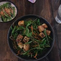Crispy fried tofu with homemade noodles and vegetables (vegan version), coconut spinach at Pobrecito in Helsinki