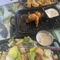 Fried pickles, cauliflower bites with bang bang sauce and Caesar salad with seitan  at Birch Bark Eatery in Glen Falls