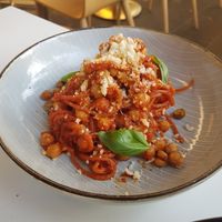 Spaghetti Al Pomodoro with chickpea ragu, crispy chickpeas and smoked tomato sugo at Mark & Vinny's Spaghetti & Spritz in Surry Hills