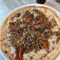 Add extra cheese if you love/loved cheesy pizza on the Vegan Pizza. It’s so good.  at Flour & Barley in Las Vegas